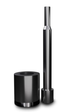 Tall metallic cylindrical component beside a shorter dark cylindrical roll on a white background
