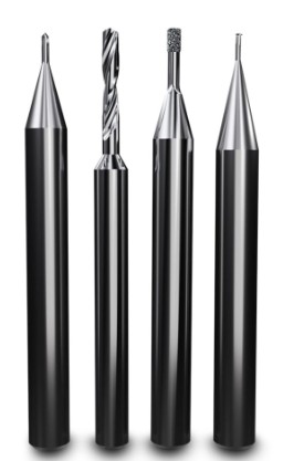 Four precision cutting and engraving tools with black shafts and silver tips