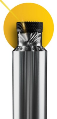 Metallic cylindrical tooling component with black ribbed cap on a yellow background